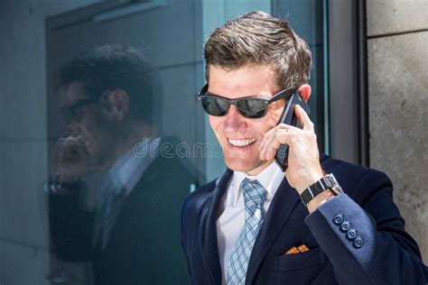 Business Man In Suit Outside The Office Talking On Phone Stock Photo