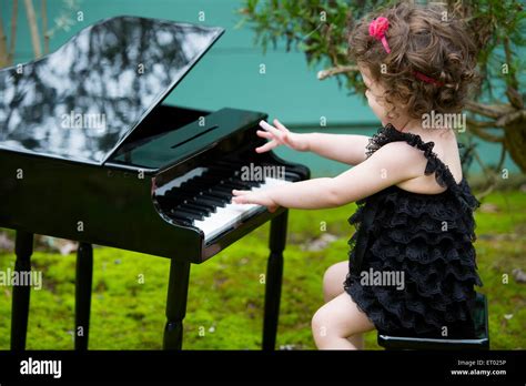 Baby Girl Playing The Piano Hi Res Stock Photography And Images Alamy
