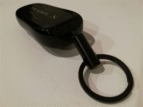 How To Set Up And Change Batteries On The Tesla Model X Key Fob Gtrusted
