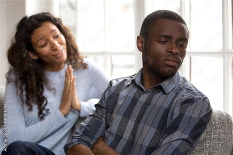 Guilty African American Woman Apologizing Black Husband Sulking Refusing To Make Peace After