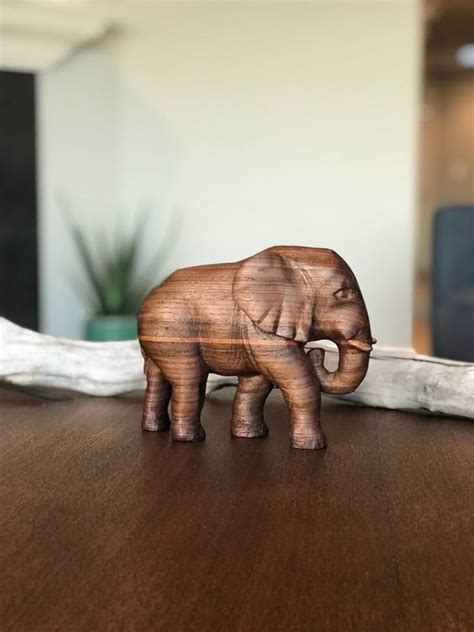 Find wooden carvings importers on exporthub.com. Walnut Elephant | Elephant, Elephant decor, Carving