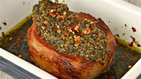 The fragrant natural oils in the thyme and pungent garlic flavor infuse into the olive oil so the pork cooks with a bouquet of aromas that transfers to the meat. Pesto-Coated Center-Cut Pork Chop Recipe - Allrecipes.com