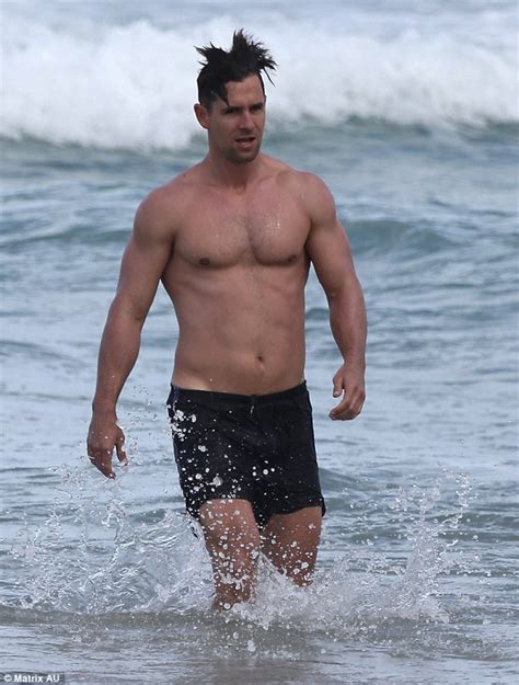 dj chris stafford shirtless at the beach as delta goodrem denies dating him daily mail online