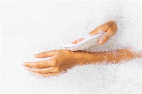 Woman Washing Hands In Bath Tub With Foam Bubbles And Use Natural Jute