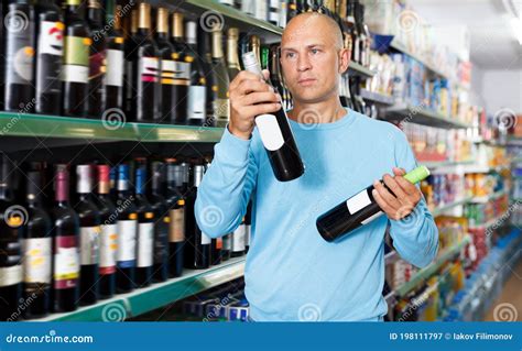 Portrait Of Lucky Customer Selecting Wine Stock Image Image Of Label