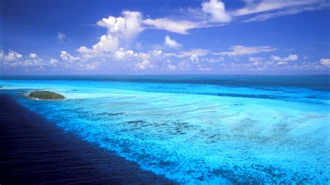 Calm Blue Body Of Water Seashore Under Blue Cloudy Sky Hd Nature