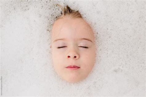 Girl Washing Her Hair In Bubble Bath Del Colaborador De Stocksy