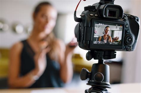 Young Female Vlogger Recording A Make Up Video For Her Vlog Society