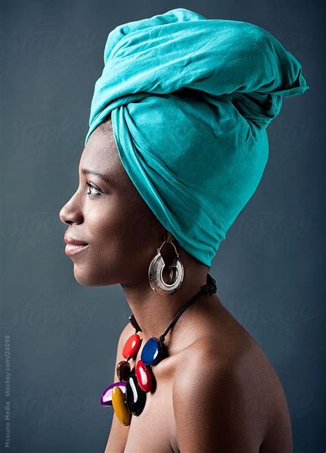 beautiful african woman with a turban on her head by stocksy contributor mosuno beautiful