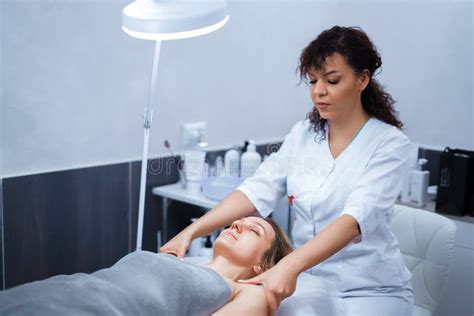 Attractive Female At Spa Health Club Getting A Facial Massage