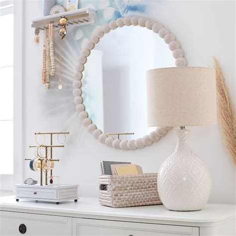 These shimmering shells will lend glamorous appeal to any design. Naturalist Ball Decorative Mirror | Pottery Barn Teen