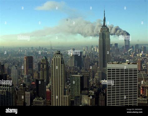 Smoke Billows Across The New York City Skyline After Two Hijacked