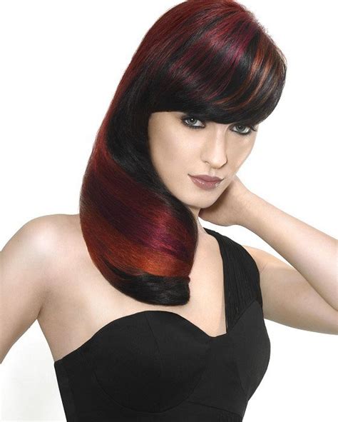 The hair color with brown streaks on black hair is good for party wear. Dark Brown Hair With Red Highlights|