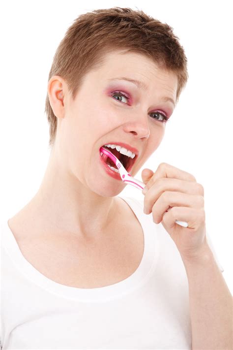 Woman Brushing Teeth Free Stock Photo - Public Domain Pictures