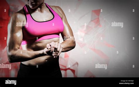 Composite Image Of Muscular Woman Flexing Her Arm Stock Photo Alamy