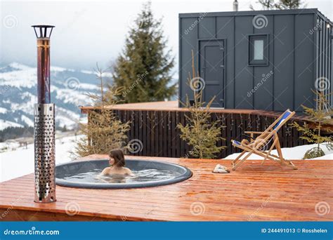 Woman Swims In Hot Bath While Resting At Small Modern House In The Mountains Stock Image Image
