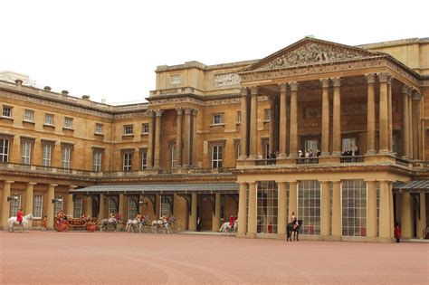 The Carriage Procession Arrives At The Grand Entrance Of Buckingham