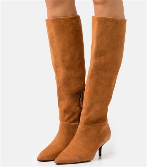 autumn 2021 s best knee high boots are selling fast who what wear uk