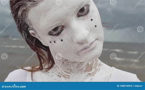Portrait Of Artistic Girl Covered In White Paint Look Into Camera On