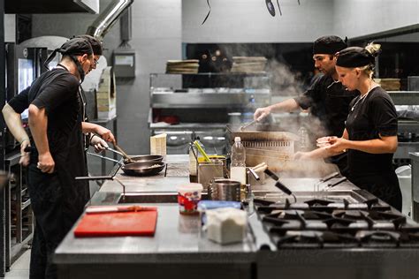 Chefs Working In The Kitchen By Stocksy Contributor Audshule Stocksy