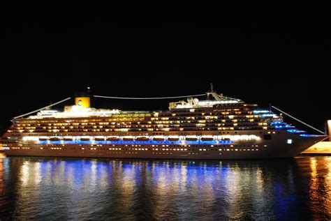 Cruise Ships At Night In Barcelona And Civitavecchia