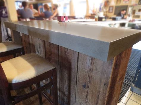 Concrete bar top installed at the compass rose brewery in raleigh nc. concrete bar top this one has reclaimed wood below the ...