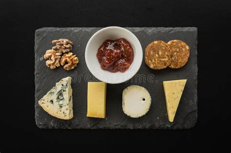 Top View Of An Assortment Of Delicious Snacks Served On A Board Stock