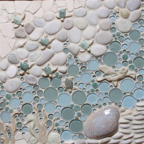 A Close Up Of A Mosaic With Rocks And Sea Shells