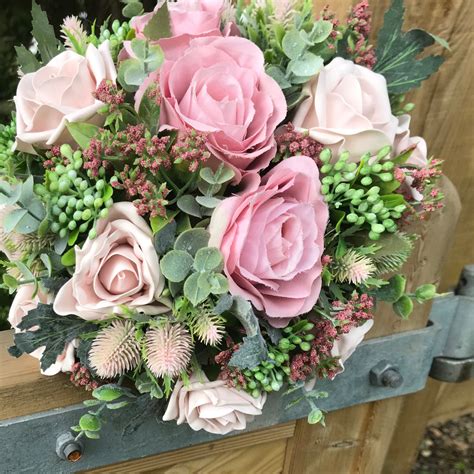 A Bridal Bouquet Collection Of Dusky Pink Artificial Silk Roses And Fo