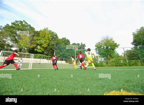 Asian Kids Playing Football Hi Res Stock Photography And Images Alamy