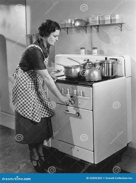 Woman Cooking On Stove Stock Photo Image Of 3040 Controls 52005302