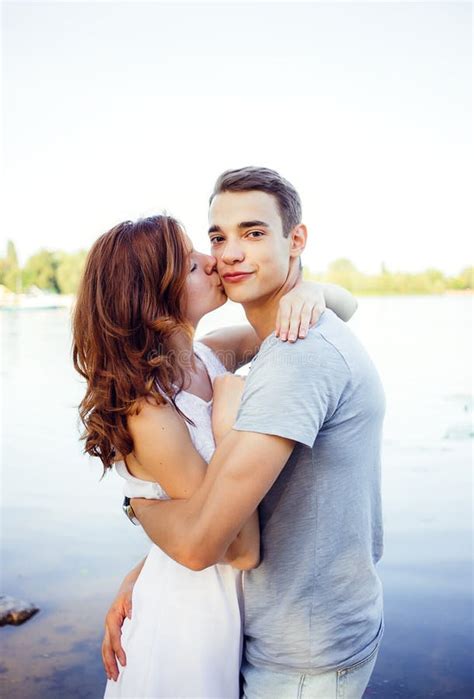 Enamored A Young Woman Kissing A Boyfriend Stock Photo Image Of Adult