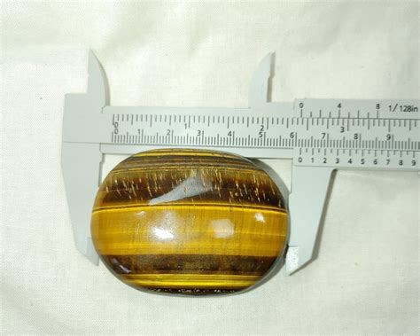 Tiger Eye Metaphysical Palm Stone 6 Fossils For Sale