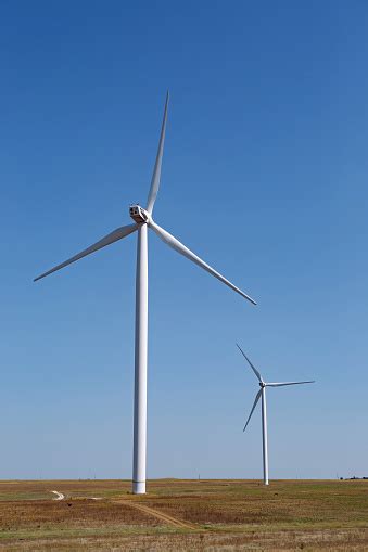 Group Of Electric Windmills Stands In A Field In The Summer In Crimea