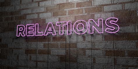 Relations Glowing Neon Sign On Stonework Wall 3d Rendered Royalty