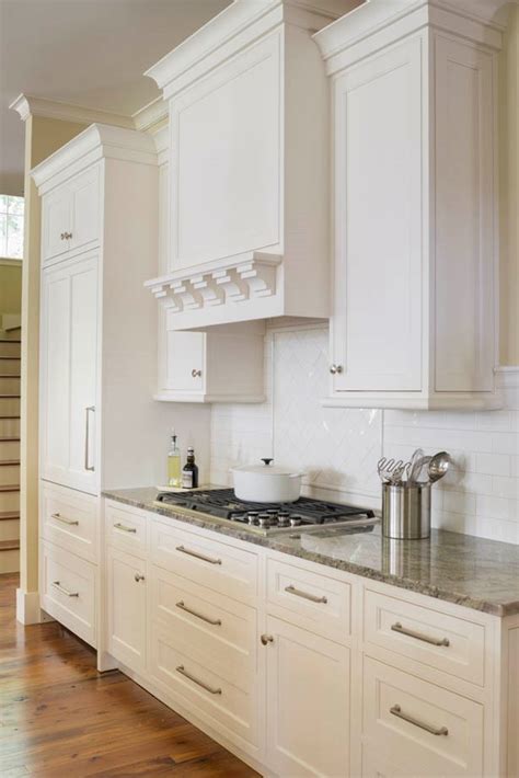 A black dutch door fitted with a porthole opens to a gorgeous cottage butler's pantry equipped with an antique wood island placed against shiplap trim below a framed print and flanked by light gray cabinets finished with marble ogee countertop. Gallery — Bremtown Cabinetry
