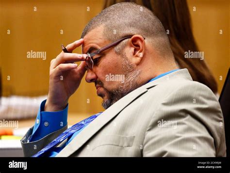 Defense Attorney Kirk Nurmi Listens As Prosecutor Juan Martinez Makes