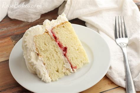Looking for a way to cut costs? Slice of Wedding Cake with Raspberry Filling | Rose Bakes