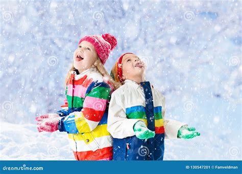 Kids Playing In Snow Children Play In Winter Stock Image Image Of
