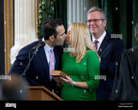 George P Bush Kisses Wife Amanda While Father Jeb Looks On At Bushs Swearing In Ceremony As