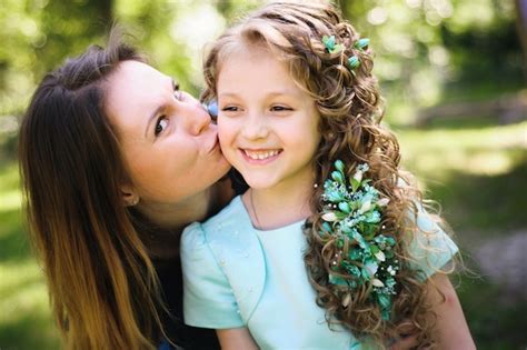 Premium Photo Happy Mother And Daughter Together Outdoors In A Park