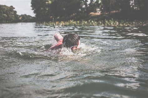Deze datum werd later veranderd naar 4 mei. The Young Man Swimming In The River Stock Photo - Image of ...