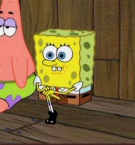 Spongebob Is Sitting On The Floor Next To A Box