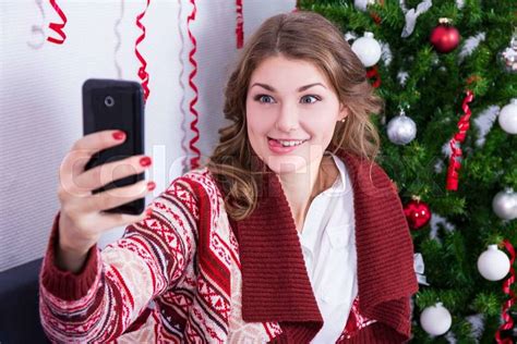 Portrait Of Funny Young Woman Taking Selfie Photo With Mobile Phone