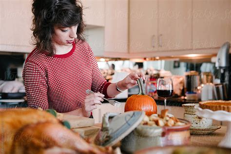Woman Prepares Thanksgiving Dinner In The Kitchen By Stocksy Contributor Cara Dolan Stocksy