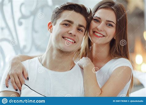 Cute Couple In Love Spending Time Together Woman Embracing Her Partner In Bed Stock Photo
