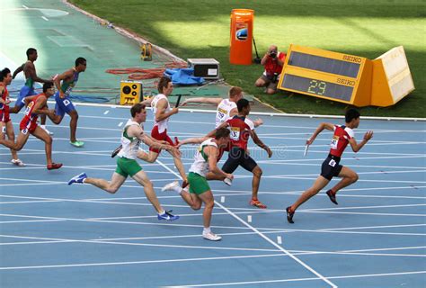 Newer version available for download 5.0.0.7220. Athletes On The 4 X 100 Meters Relay Race Editorial Stock ...