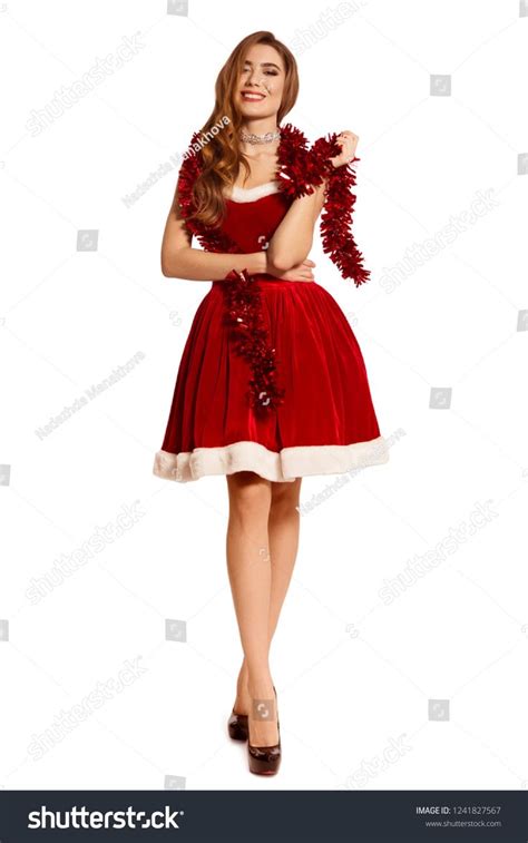 Beautiful Woman In A Red Dress In Full Growth Long Slender Legs Santa