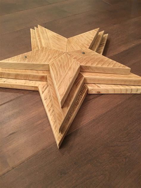 Three Wooden Star Shaped Trays Sitting On Top Of A Wood Floor