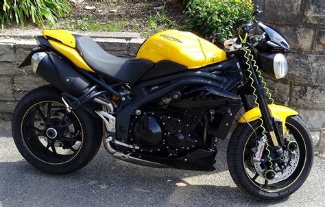 Triumph Yellow And Black Motorcycle Free Stock Photo Public Domain